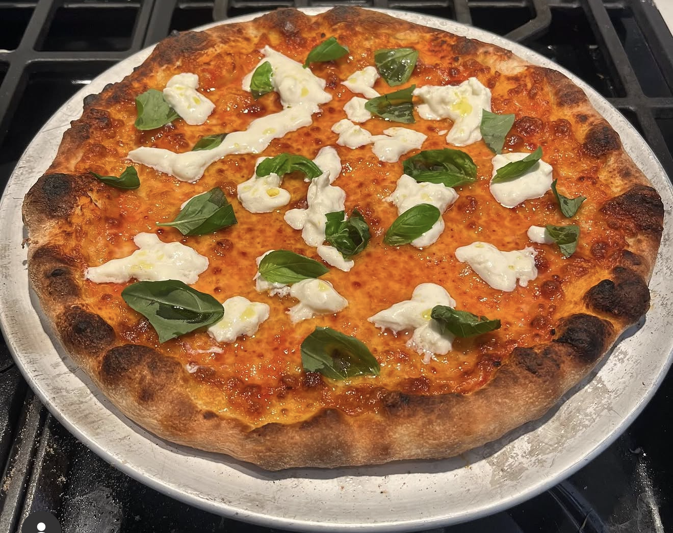 A Pizza Cola NY-style burrata pizza, made at home