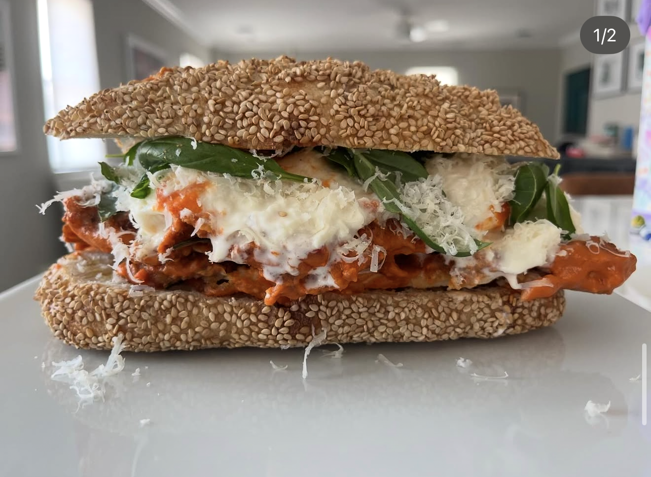 Chicken parm and burrata on a seeded sourdough roll